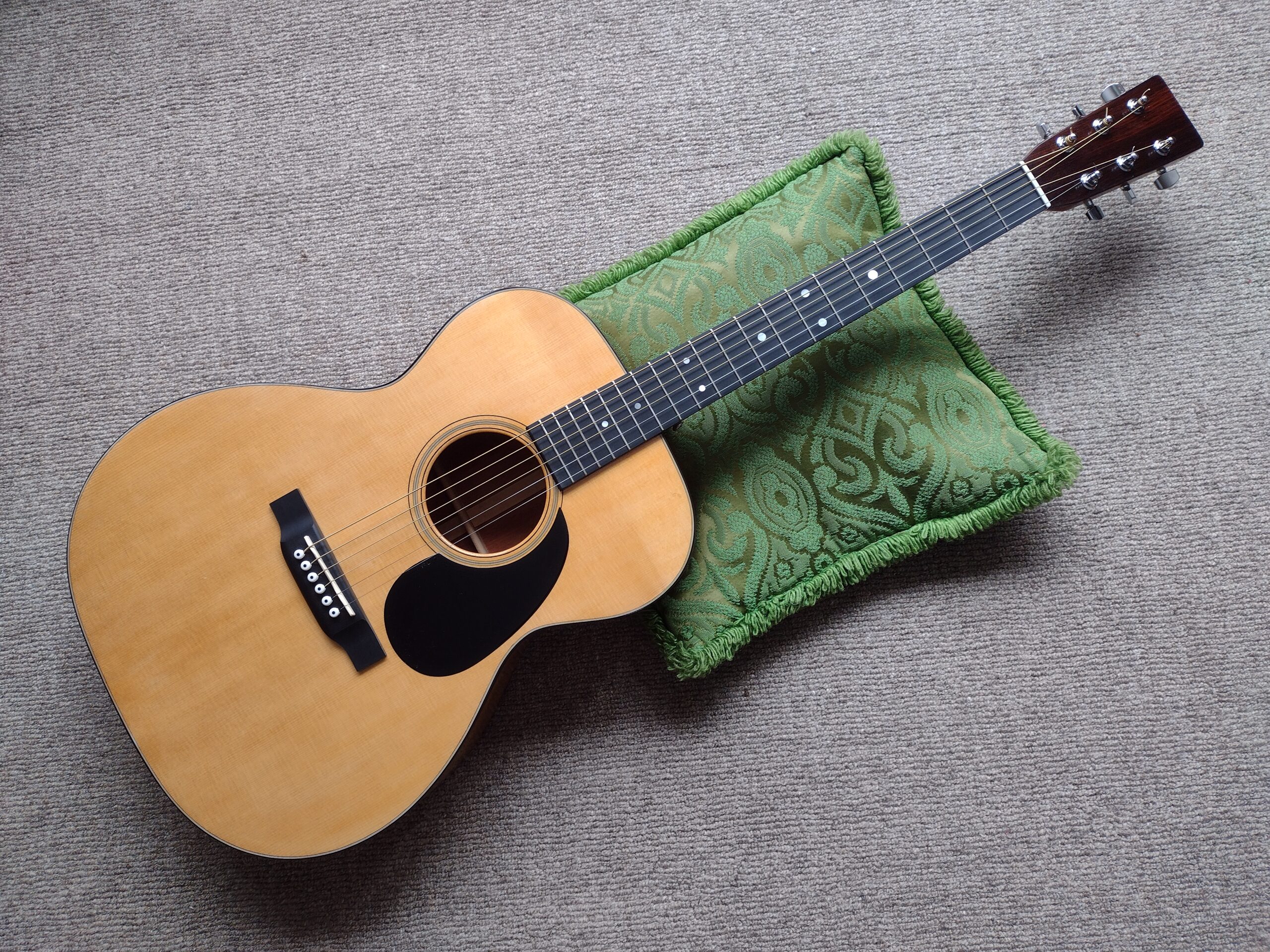 an acoustic guitar viewed from the front
